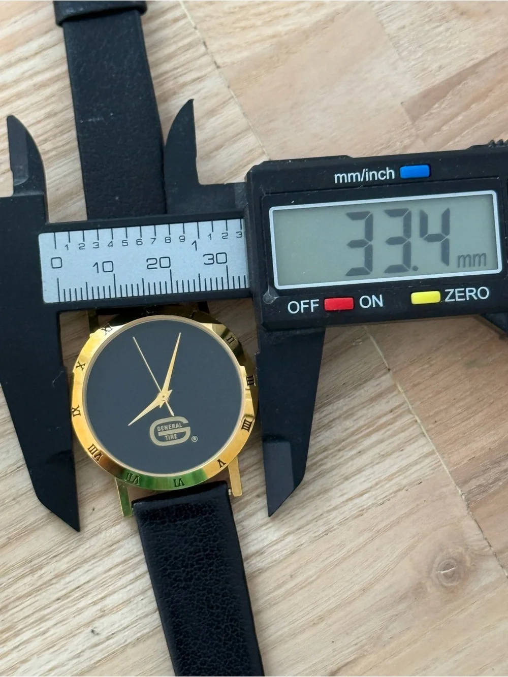 General Tire Dress Watch Black Dial Leather Strap Gold-Tone Case Hands
